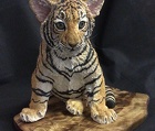 Tiger Cub on wood panel